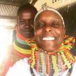 Jewellery Fashion designer Patricia Mbela poses for a picture with a Turkana woman who made her a beaded cuff with the Kenyan flag